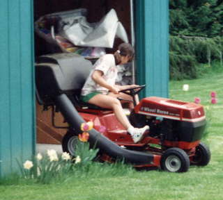 Sally Wright mowing the lawn (zoom)