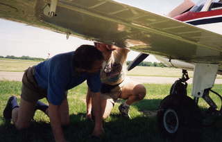 Dick Lind and Adam checking fuel