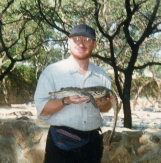 32 35o. Satish-Geeta wedding in Madras, India - Adam and small crocodile close up