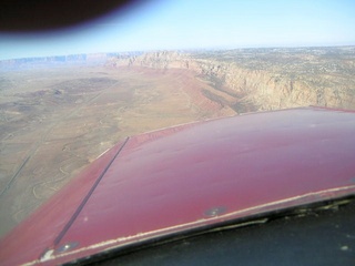39 59p. Echo Cliffs over airplane nose - aerial