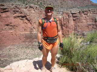 Plateau Point -- Mighty Colorado River -- Adam on rock ledge