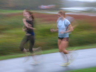 blurry finishers in the rain