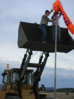 Young -- Chapman Ranch Airport - loader raising Arv and Bob for wind sock replacement