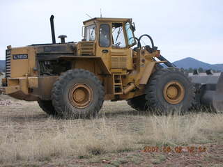 Young -- Chapman Ranch Airport - Arv on loader working on wind sock
