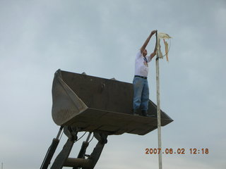 Young -- Chapman Ranch Airport - Arv on loader working on wind sock