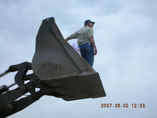 Young -- Chapman Ranch Airport - Arv on loader working on wind sock