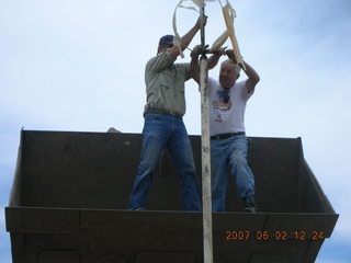 Young -- Chapman Ranch Airport - Arv and Bob on loader replacing wind sock