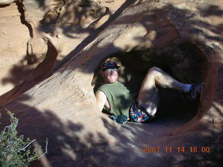 688 6be. Arches National Park - Devils Garden hike - Adam in hole in rock