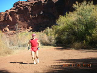 5 6bg. Canyonlands National Park - Lathrop Trail hike - Adam (tripod) running