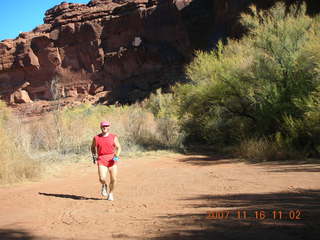 6 6bg. Canyonlands National Park - Lathrop Trail hike - Adam (tripod) running