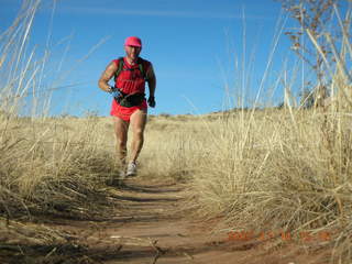 10 6bg. Canyonlands National Park - Lathrop Trail hike - Adam (tripod) running