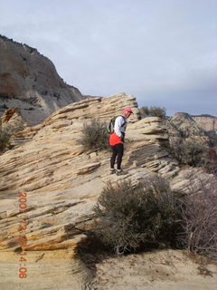 732 6cv. Zion National Park - Angels Landing hike - Adam climbing at the top