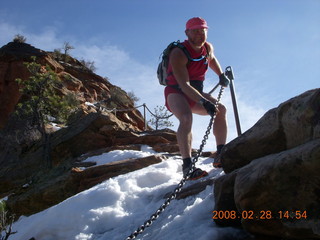 809 6eu. Zion National Park - Angels Landing hike - Adam coming down the icy part