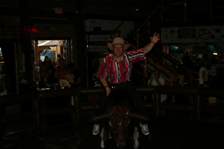Saddle Ranch Adam posing on the bull (dark)