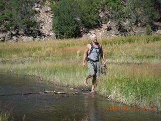 Dustin crossing rivier - hiking at Pine Valley, Utah