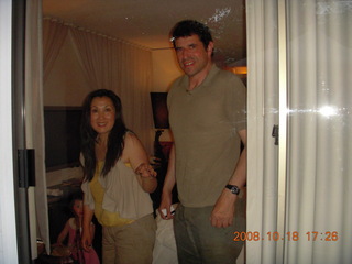 Jane trying on cowboy hat with Abigail in mirror