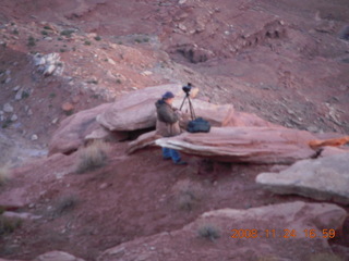 Canyonlands Grandview at sunset + photographer below