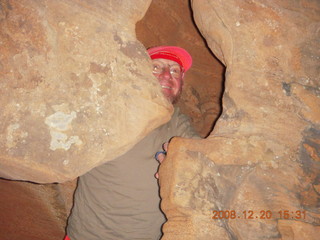 966 6ql. Zion National Park - Angels Landing hike - Adam peeking through rock in Refrigerator Canyon