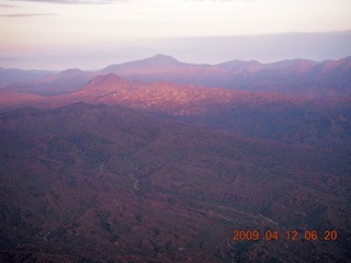 aerial - mountains near Red Creek with strip of sunlight