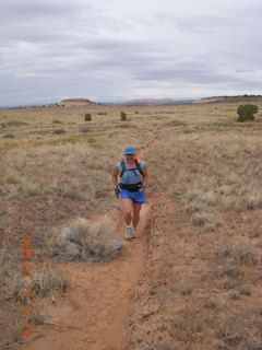 1010 6uh. Canyonlands - Lathrop trail hike - Adam running - grassy run at end
