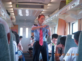 57 6xp. China eclipse - Hangzhou to Shanghai train ride - lady selling toys