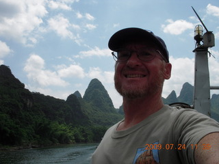 342 6xq. China eclipse - Li River  boat tour - Adam backlit