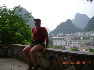 China eclipse - Yangshuo steps up the mountain - Adam at the summit (backlit)