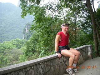 46 6xr. China eclipse - Yangshuo steps up the mountain - Adam at summit (the good one)