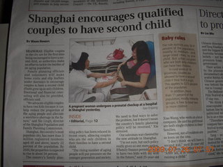 China eclipse - newspaper article about second-child laws