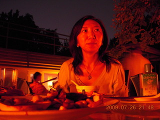 144 6xs. China eclipse - Sonia at restaurant in park in Beijing (low light)