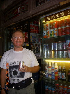 China eclipse - Beijing night alleys and shops - Adam and coke cans