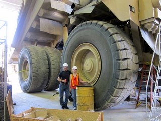 Sean's picture - Bagdad mine tour - Sean and Kristina and big tire