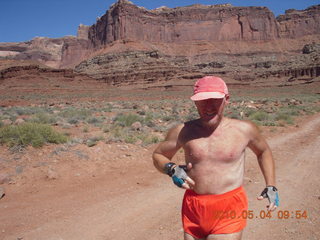 1207 774. Canyonlands Lathrop Trail hike - Adam running on white rim road