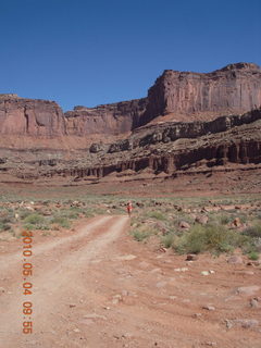 1210 774. Canyonlands Lathrop Trail hike - Adam running on white rim road