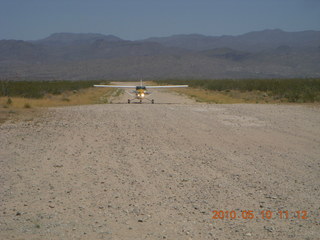 128 77a. Alamo Lake airstrip - landing airplane