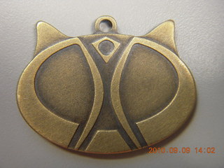 Sean's cat medallion from Burning Man