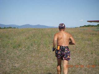 42 7c2. Adam running at Me-Own airstrip (with SPOT on the belt strap) - back
