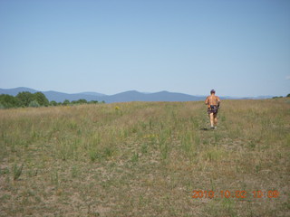 44 7c2. Adam running at Me-Own airstrip (with SPOT on the belt strap) - back
