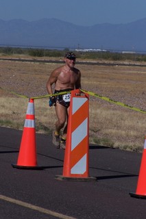 1323 7cw. Safford fly-in and half marathon - Ken's photo - Adam running, finishing