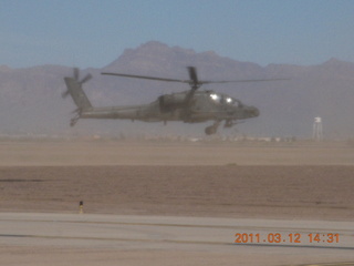 Apache helicopter flying at Gateway Airport (IWA)