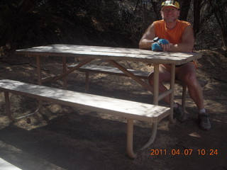 20 7j7. Canyonlands Lathrop hike/run - Adam at riverside picnic table at (tripod)