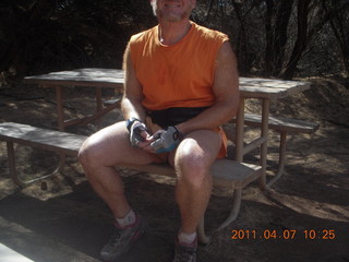 21 7j7. Canyonlands Lathrop hike/run - Adam at riverside picnic table at (tripod)