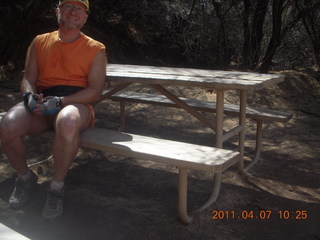 22 7j7. Canyonlands Lathrop hike/run - Adam at riverside picnic table at (tripod)