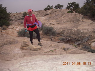 1437 7j8. Canyonlands Needles Slickrock hike - Adam (tripod)