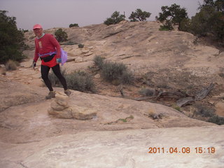 1438 7j8. Canyonlands Needles Slickrock hike - Adam (tripod)