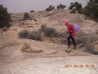 1439 7j8. Canyonlands Needles Slickrock hike - Adam (tripod)