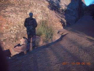 1641 7q9. Arches National Park - Devil's Garden hike - Adam's shadow