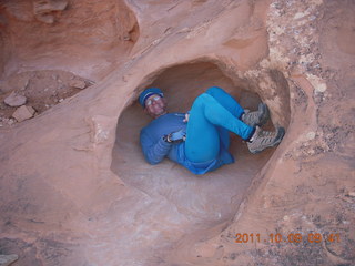 1643 7q9. Arches National Park - Devil's Garden hike - Adam in hole in rock