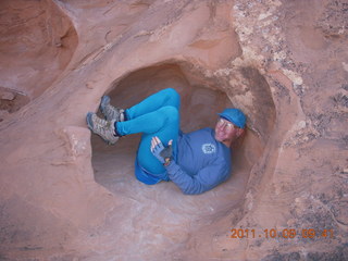 1644 7q9. Arches National Park - Devil's Garden hike - Adam in hole in rock