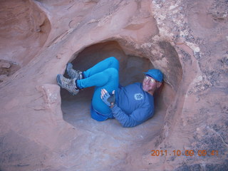 1645 7q9. Arches National Park - Devil's Garden hike - Adam in hole in rock
